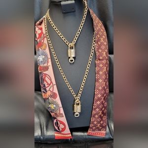 Louis Vuitton lock and key sets. (2)With unbranded Chain